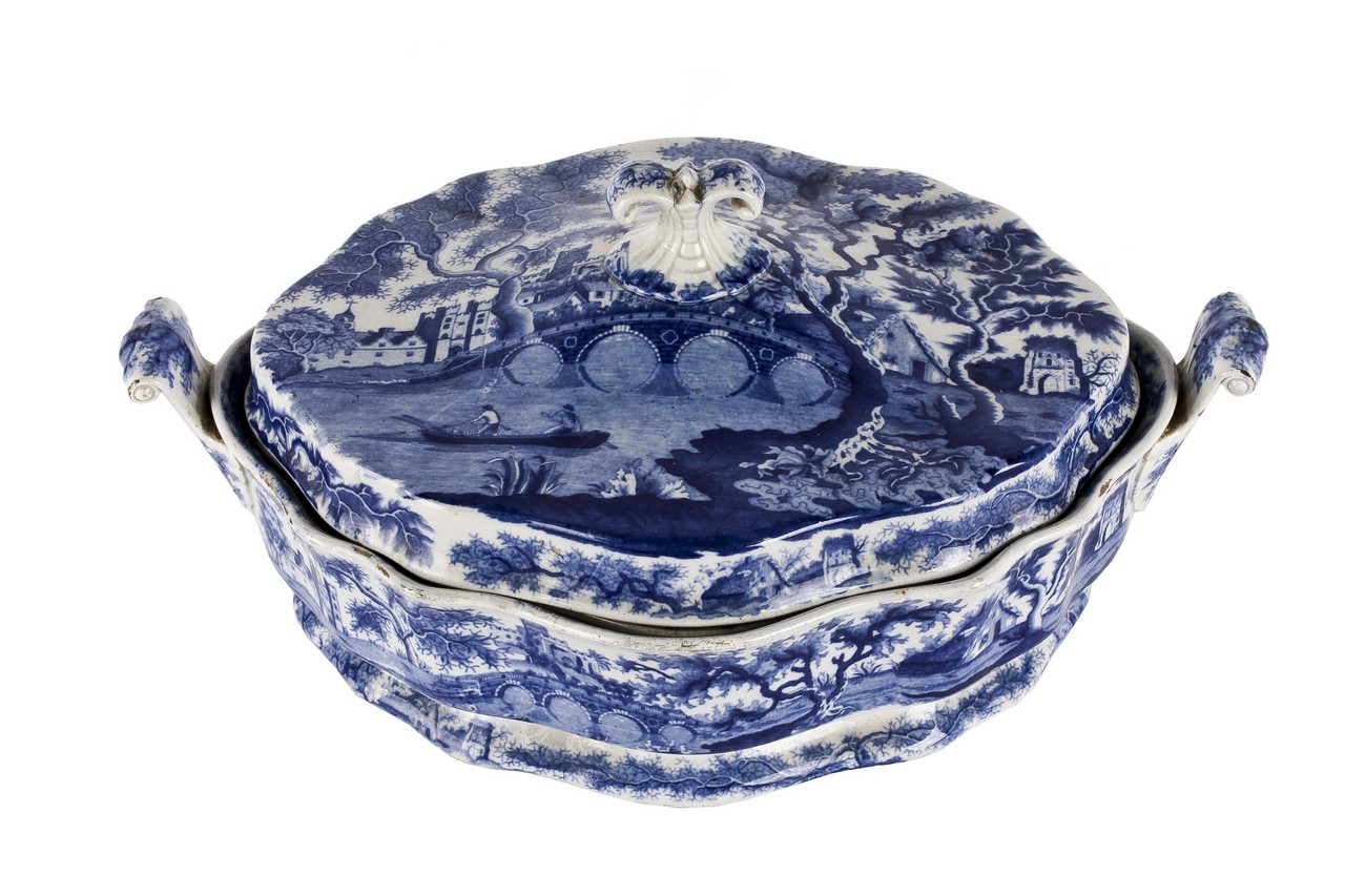 A 19th century blue and white tureen with cover and inner liner, decorated with castle and bridge in