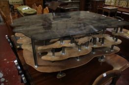A plywood, chromed metal and perspex mounted coffee table by Karen Tang, Knight`s Table, circa 2006
