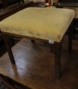 A Victorian upholstered stool and a George III style stool with blind fret carved legs
