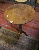 A 19th Century oak cricket table and an oak tripod table (2)