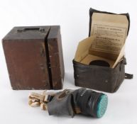 A British WWII period respirator, in original cardboard box and oilskin case; with an associated