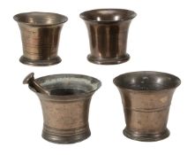 Four English bronze mortars, 18th century, all with flared body and variously knopped, the largest