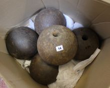 Five large cast iron mortar bomb rounds, probably early 19th century, each approximately 8.5
