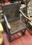 An oak open armchair 17th century and later with a lozenge carved back