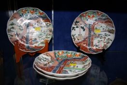 A set of four Imari plates of shaped form, 21.5cm in diameter