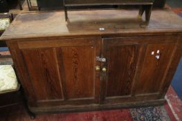A late 19th Century pitch pine side cabinet 143cm wide