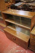 A mid 20th Century oak four tier bookcase with glass doors 140cm high, 90cm wide and another similar