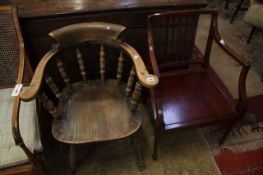 A 19th century carved oak armchair and another armchair.