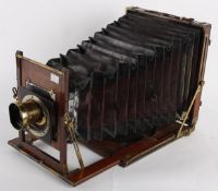 W. Watson & Sons, London, a mahogany and brass camera, the glass plate measuring 10 x 8 inches, with