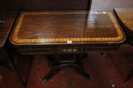 A Regency rosewood and brass inlaid folding card table 91cm wide