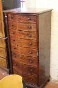 A Victorian style mahogany serpentine fronted wellington chest 139cm high, 69cm wide