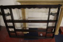 A set of oak hanging shelves in 18th century style