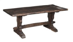 An elm refectory table by Jack Grimble of Cromer, 20th Century on shaped trestle supports and feet