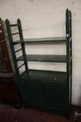 A painted side cabinet with shelves and cupboards
