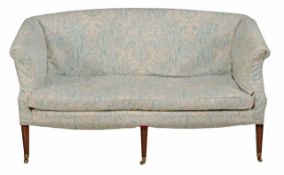 A George III and later mahogany sofa circa 1810 with an arched back and outswept arm supports on