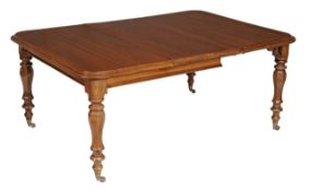 A Victorian mahogany extending dining table, circa 1840, to include two leaf insertions, on four
