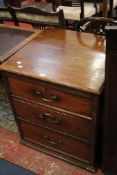 A three drawer oak chest 65cm wide