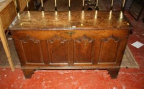 A late 18th/early 19th Century oak coffer with arched fielded panels 137cm width, 47cm depth.