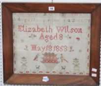 A framed and glazed sampler by `Elizabeth Wilson, Aged 8, May 18th 1853`; 35.5 x 43.5cm Best Bid