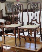 A pair of Edwardian mahogany side chairs with pierced splats