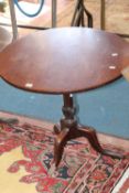 A mahogany circular topped tripod table in George III style 72cm diameter  Best Bid