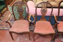 A pair of Hepplewhite style mahogany armchairs with carved pierced splat