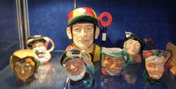 A Royal Doulton character jug `Jockey` (D6625) together with three smaller examples: `Old Salt` (