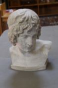 A plaster bust of a classical figure with `Thorvaldsens Museum` plaque impressed verso; 38cm high