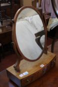A George III mahogany bowfront dressing mirror, an Edwardian bedroom chair, and a needlework
