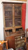 A George III mahogany bureau bookcase with a fitted interior and well, two short and two long