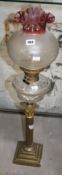 A 19th Century brass oil lamp with Corinthian column base; 77cm high