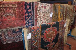 A Shiraz rug, a Tekke rug, an African rug and another Afghan rug, etc worn