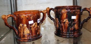 Two large treacle glazed twin handled frog mugs