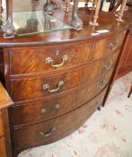 A 19th Century mahogany bowfront chest with two short and three long graduated drawers, on swept
