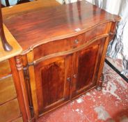 A stained two door side cabinet, German, late 19th century with serpentine shaped frieze drawer