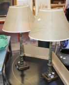 A pair of painted metal table lamps modelled as classical columns (sold as parts) Best Bid