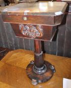 A 19th century rosewood sewing table on circular pedestal base 70cm high, 47cm wide