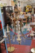 A six branch glass and brass electrolier with additional decorative glass drops; 75cm high (sold as