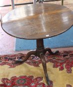 A 19th Century oak tripod table 77cm diameter  Best Bid