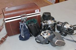 A small quantity of cameras, including a Pentax K1000 together with mixed lenses and carry cases