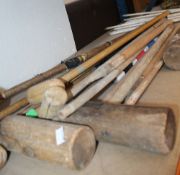 A quantity of vintage croquet wooden mallets, metal hoop, balls etc.  Best Bid