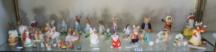 A group of Beswick Beatrix Potter figures, similar Disney examples and various Royal Doulton