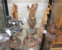 A quantity of carved religious wooden figures, a patinated model of a horse and two squat wooden