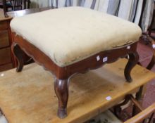 A 19th Century Continental upholstered stool with shaped frieze and legs 63cm wide