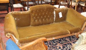 A 19th Century arched back sofa on outswept legs (a/f) Best Bid