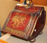 A 19th Century tole coal box, gilt flower decoration on a red ground, complete with coal shovel