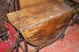 A 17th Century style oak gateleg table 76cm high, 107cm wide Best Bid