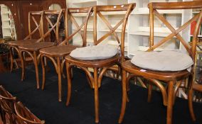 A set of eight bentwood and caned chairs each with X-frame splat