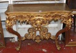 A carved giltwood and composition console table, 96cm wide