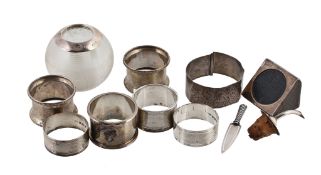 A collection of silver, to include: a glass globular match striker with... A collection of silver,